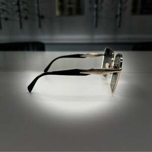 Womens Prada Stylish Gold and Black Sunglasses